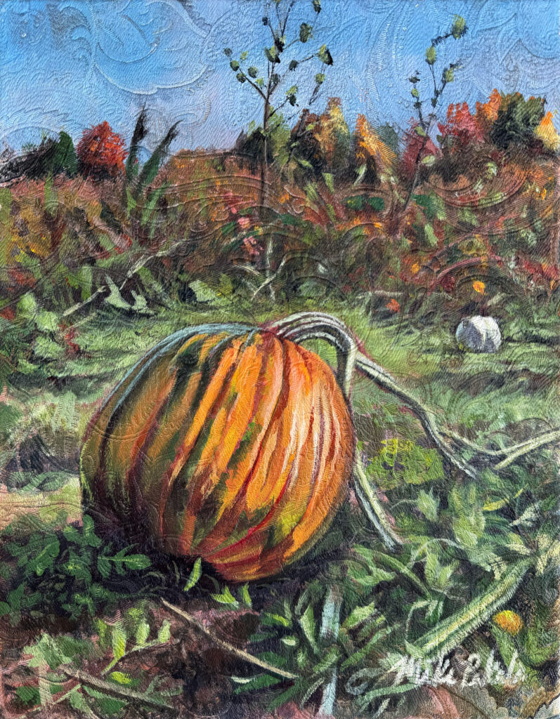 Pumpkin painting in a field